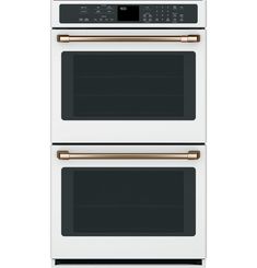 two ovens side by side with the doors open