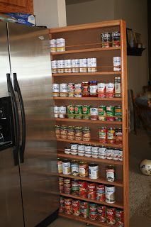 a shelf with canned food in it and the words how to build a slim sliding kitchen cabinet