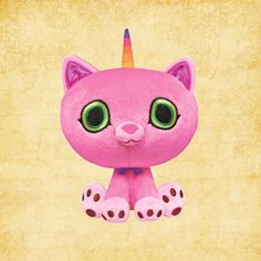 a pink stuffed animal with green eyes and a horn on it's head sitting in front of a yellow background