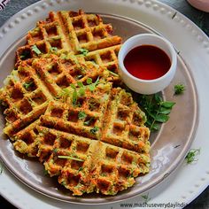 some waffles are sitting on a white plate