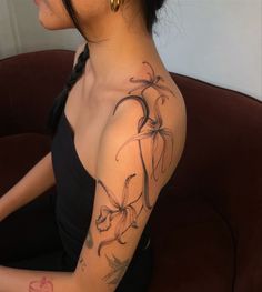 a woman with a tattoo on her arm