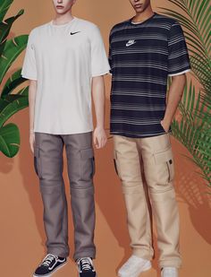 two young men standing next to each other in front of a palm tree and wall