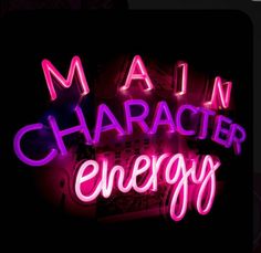 a neon sign that says main character energy in pink and purple letters on a black background