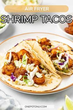 air fryer shrimp tacos on a plate with cole slaw