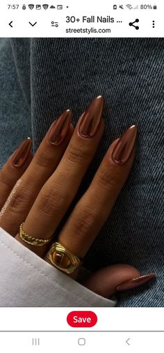 someone is showing off their nails and gold rings on their fingernails, with the caption save