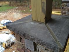 a brick oven with a wooden door on top