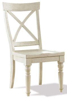 a white wooden chair with a cross back and wood legs on an isolated white background