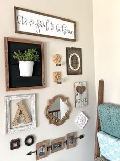 the wall is decorated with various items such as frames, letters, and other things