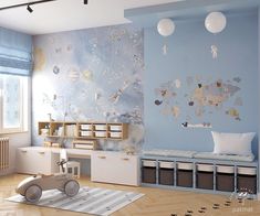 a child's room decorated in blue and white