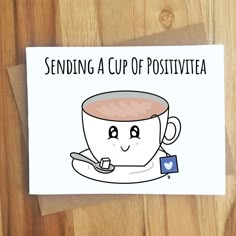 a greeting card with a cup of positive tea on it