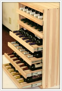 a wooden wine rack filled with lots of bottles