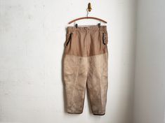 Vintage canvas double knee hunting pants circa 1940. Original FALCON BRAND / SE WOODS SPORTSWEAR men's waxed cotton trousers made in Canada. With heavy canvas fronts and leather trim at pockets and pantleg cuffs. Abbot metal zipper. Beautiful details and tons of character. Very nice estate-found condition. Perfect vintage patina with minor signs of wear. MEASUREMENTS:  Waist: 34 Inseam: 28 CONDITION: very good and solid with minor vintage wear as shown, leather trim a bit dry and stiff in places Double Knee Pants, Hunting Pants, Knee Pants, Cotton Trousers, Vintage Dog, Vintage Canvas, Mens Sportswear, Metal Zipper, Waxed Cotton