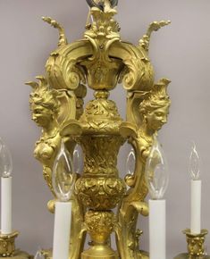 an ornate golden chandelier with candles