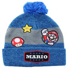 Wear your love of Super Mario with this cozy winter beanie. Made of comfy and warm acrylic, this stylish blue beanie features classic Mario character patches. This fun Mario fan accessory is available in one size that easily fits most. Officially licensed. Super Mario Bros 1985, Mario Design, Super Mario Hat, Childrens Crochet Hats, Shigeru Miyamoto, Game Designer, Super Mario Galaxy, Blue Beanie, Video Game Design