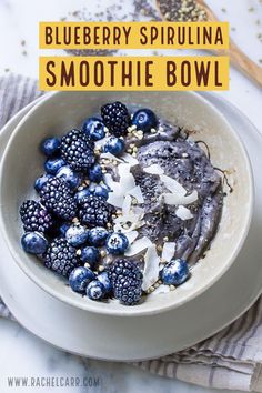 blueberry spirula smoothie bowl with blackberries and coconut flakes in it