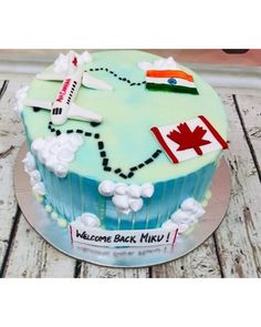 a birthday cake decorated with an airplane and flags