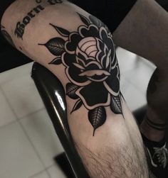 a person with a tattoo on their leg