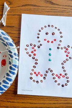 a paper plate with candy on it next to a piece of paper that says love