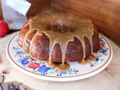 a bundt cake sitting on top of a plate with caramel drizzle