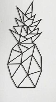 a metal pineapple on a white wall