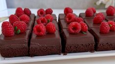 there are chocolate squares with raspberries on top