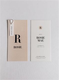 two business cards with the letter r in black and white, on top of each other