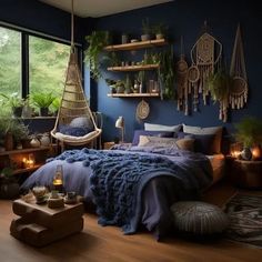 a bedroom with blue walls and lots of plants on the shelves above the bed is lit by candles