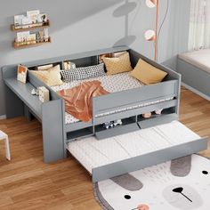 a child's bed with a pull out trundle