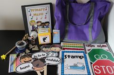 a purple bag sitting on top of a table next to some cards and stickers