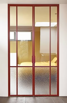 an open glass sliding door in a bedroom