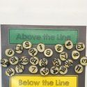 an old typewriter has been decorated with buttons and letters that spell out below the line