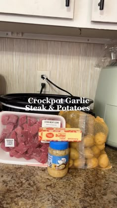 the ingredients for crockpot garlic steak and potatoes are sitting on the counter top