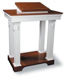 a white and brown table with a book on top