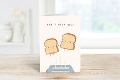 a father's day card with two slices of bread on top of a toaster