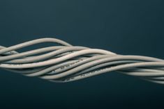 a close up view of an electrical wire that is white and has many wires attached to it