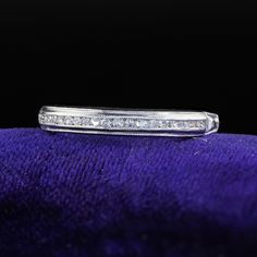 Beautiful Antique Art Deco Platinum Single Cut Diamond Engraved Half Band Ring. This classic Art Deco wedding band is crafted in platinum. The ring features single cut diamonds set on top of the band. The inside of the band is engraved "P, M. to A. C. 9/27/42". The ring is in great condition and sits low on the finger. Item #R2055 Metal: Platinum Weight: 2 Grams  Size: 5 Diamonds: Approximately .15 cts Color: H Clarity: VS2 Measurements: Top of the ring measures 2.91 mm wide and band measures 1.50 mm wide. Measurements off the finger: 1.69 mm high Layaway: For your convenience, we will be happy to provide layaway payment options. Please contact us to work out a layaway plan which best suits your needs. All layaway purchases are final sale. All domestic and international shipments are shipp Classic Diamond Band With Prong Setting, Classic Diamond Bands With Prong Setting, Classic Silver Band With Vvs Clarity, Classic Silver Bands With Vvs Clarity, Classic Eternity Band With Diamond Accents For Formal Occasions, Luxury Diamond Cut Bands Made Of Diamond, Luxury Platinum Eternity Band Promise Ring, Luxury Diamond Round Band, Luxury Anniversary Bands With Diamond Accents