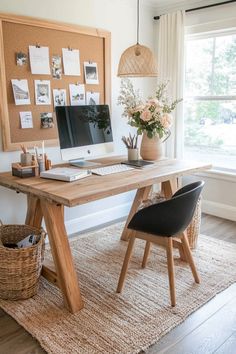 a wooden desk with a computer on it in front of a window and some plants