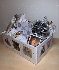 a white box filled with pictures and disco balls