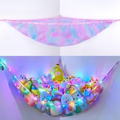 there is a hammock filled with stuffed animals and lights on it's sides