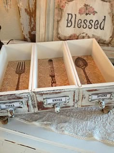 an old wooden box with utensils in it sitting on top of a table