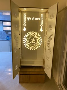 an open door leading into a room with lights on the wall and a sign that says om shanti