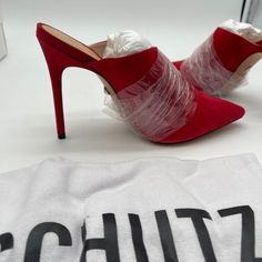 Elevate Your Style With These Stunning Red Stiletto Slip-On Shoes From Schutz. The Pointed-Toe Pump Is Perfect For Any Occasion, Whether It's A Night Out At The Club Or A Fancy Dinner Party. The Shoes Are New With Box And Have A Red Suede Upper And Leather Sole. Comes With A Dust Cover Bag. These Schutz Shoes Are Designed As A Slip-On, Making Them Easy To Put On And Take Off. The Heel Style Is A Classic 4” Stiletto, Adding An Extra Touch Of Elegance To Your Outfit. The Shoes Are Available In Siz Luxury Mules With Red Sole For Party, Luxury Red High Heeled Mules, Luxury Elegant Mules With Red Sole, Luxury High Heel Mules With Red Sole, Luxury Chic Mules With Red Sole, Luxury Formal Mules With Red Sole, Luxury Party Mules With Red Sole, Luxury Red Sole Mules For Evening, Luxury Evening Mules With Red Sole