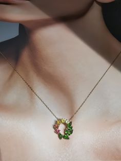 ♥ Gemstone Used: Tourmaline and Diopside ♥ Stone size: 11 gemstones ♥ Stone Shape: different ♥ Secondary Stone: Cubic Zirconia ♥ Material: 925 sterling silver, rhodium plated ♥ Chain length: 45 cm ♥Pendant length: 15*17 mm C A R E ∙ I N S T R U C T I O N S ♥ - Jewelry should be stored separately in an airtight jewelry box. - Avoid direct contact with perfume, body lotions or other chemicals. - Remove jewelry before going to bed or participating in physical activity. - You can easily make silver Wreath Necklace, Natural Gemstone Necklace, Before Going To Bed, Body Lotions, Gift For Woman, Summer Necklace, Gold Gift, Physical Activity, Summer Jewelry