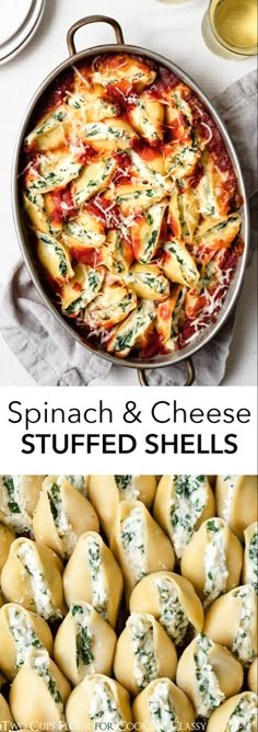 spinach and cheese stuffed shells in a pan on a table next to other dishes