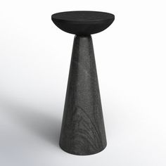 a small black table sitting on top of a white floor