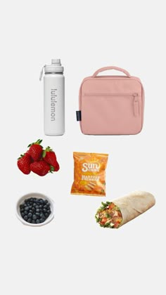 the contents of a lunch box including strawberries, blueberries, and burritos