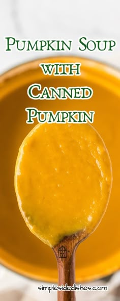 a spoon full of pumpkin soup with canned pumpkin in the background and text overlay that reads pumpkin soup with canned pumpkin