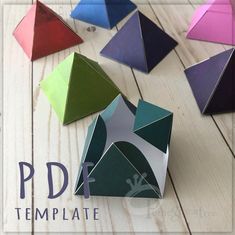 there are many different colored paper shapes on the wooden table with text overlay that reads, pdd template