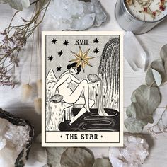 the star tarot card surrounded by crystals