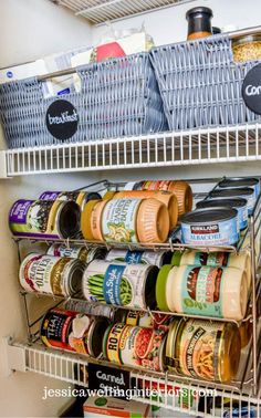 an organized pantry with canned food and condiments